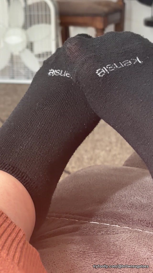 wiggling toes in black socks ✨