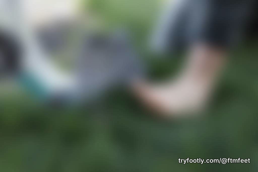 Dirty working FTM feet in the grass