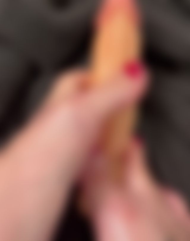 Oil and dildo foot play