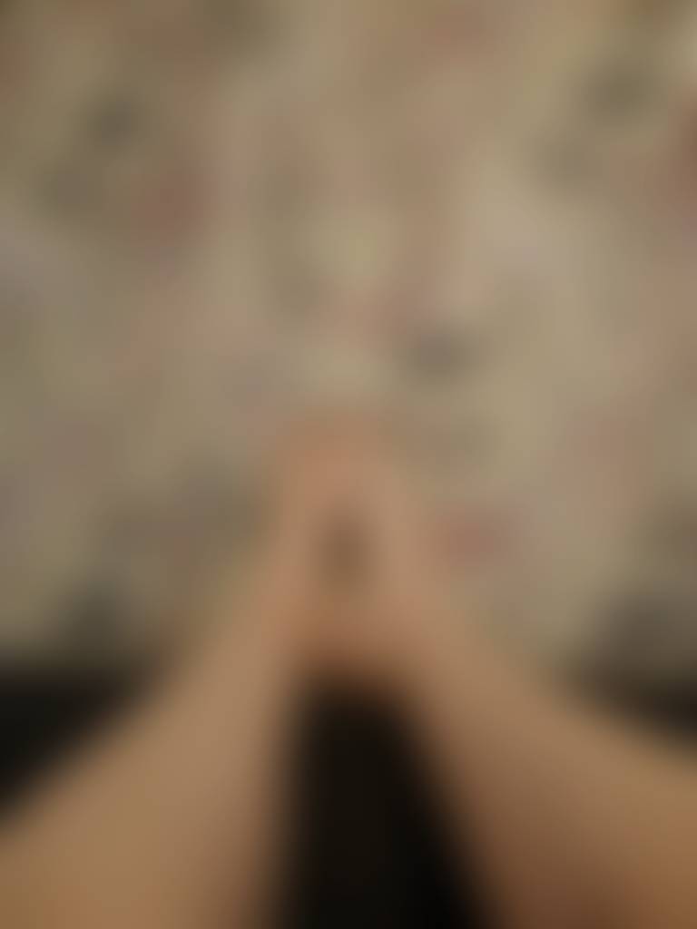Feet against wallpaper