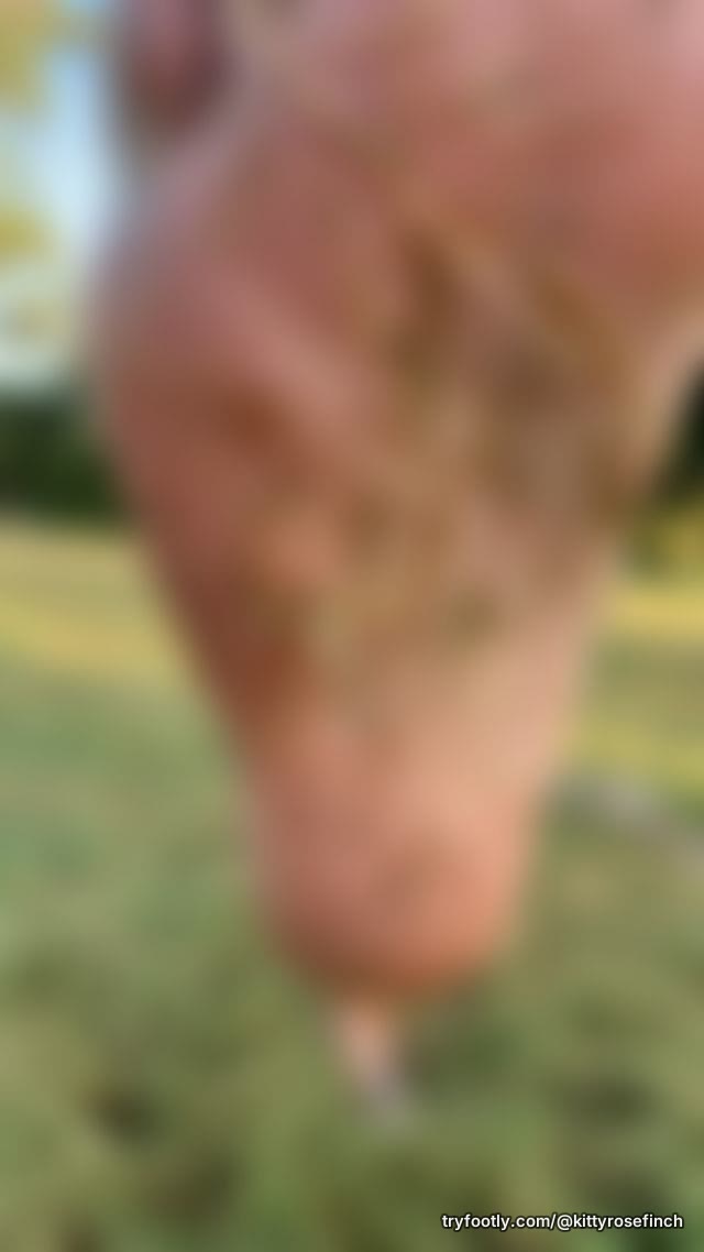 Watch as I present grassy soles to the camera in a red mini skirt.