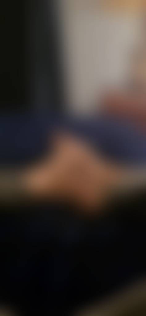 Lying in bed.
