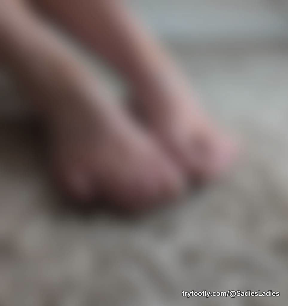 Oiled up with close ups of toes and soles